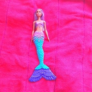 I am selling a mermaid Barbie doll.